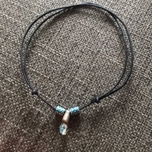 Name “Kristen” on a grain of rice necklace